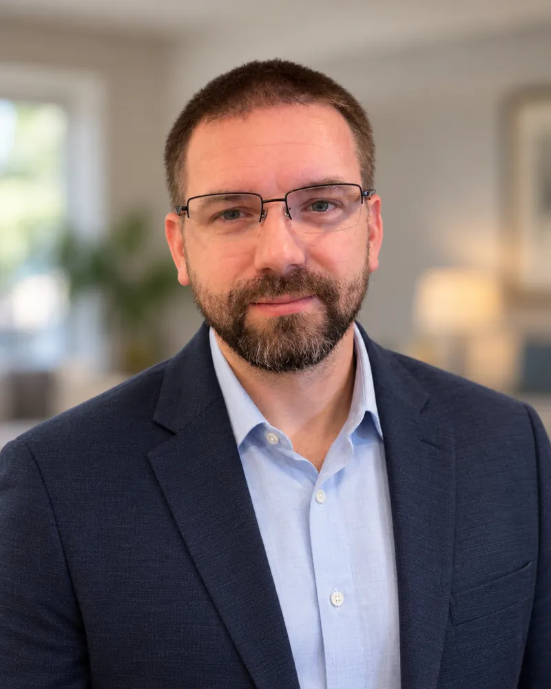 Fred Moore III, REALTOR®, in a navy blazer